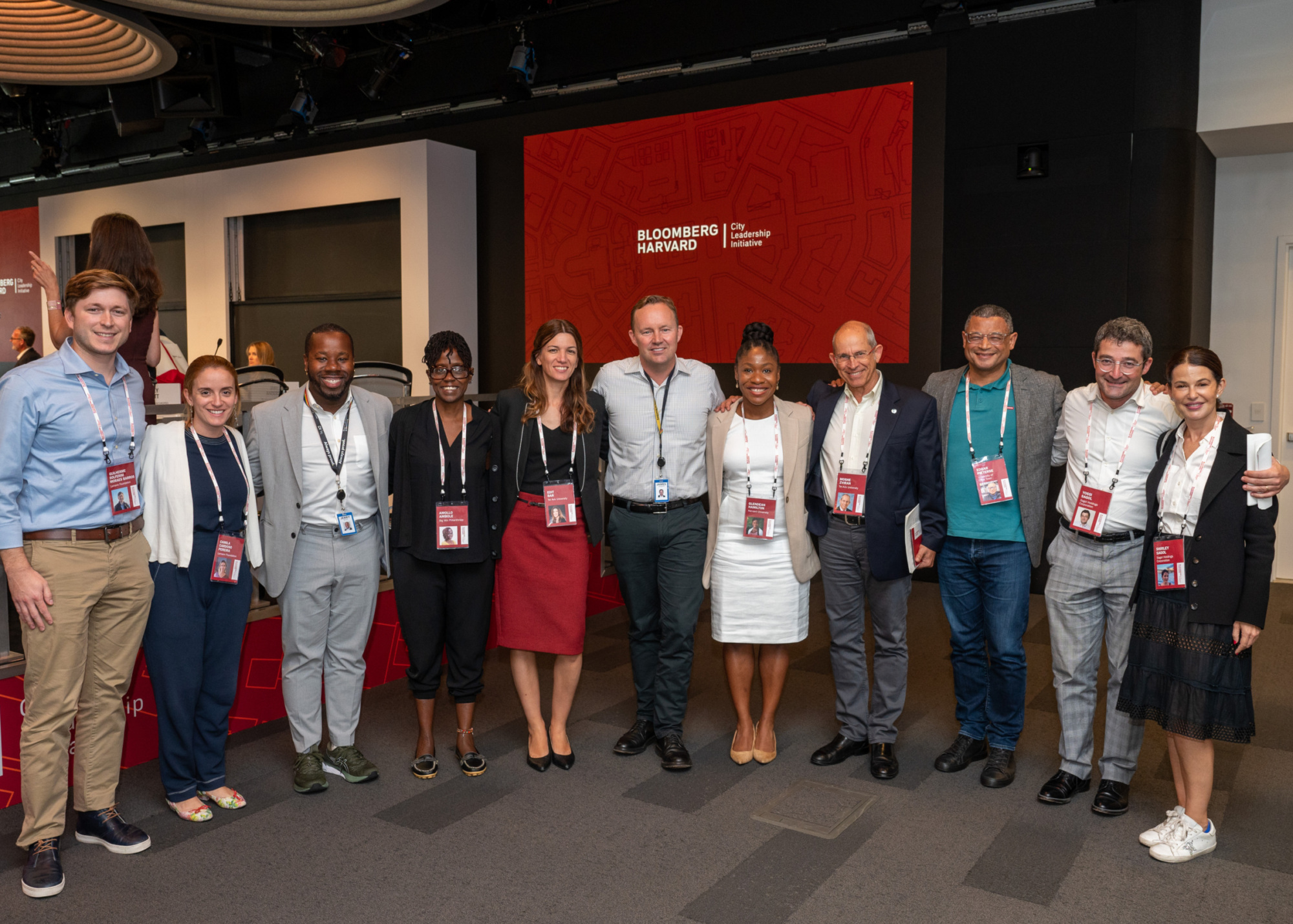 A group of people pose at a meeting