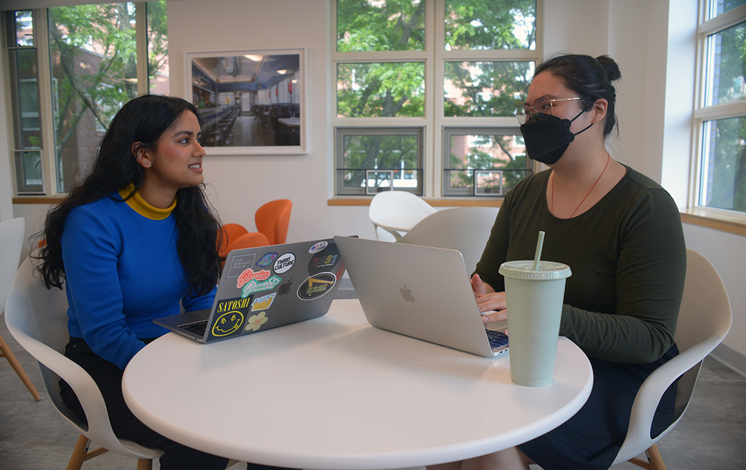 Two research assistants talking