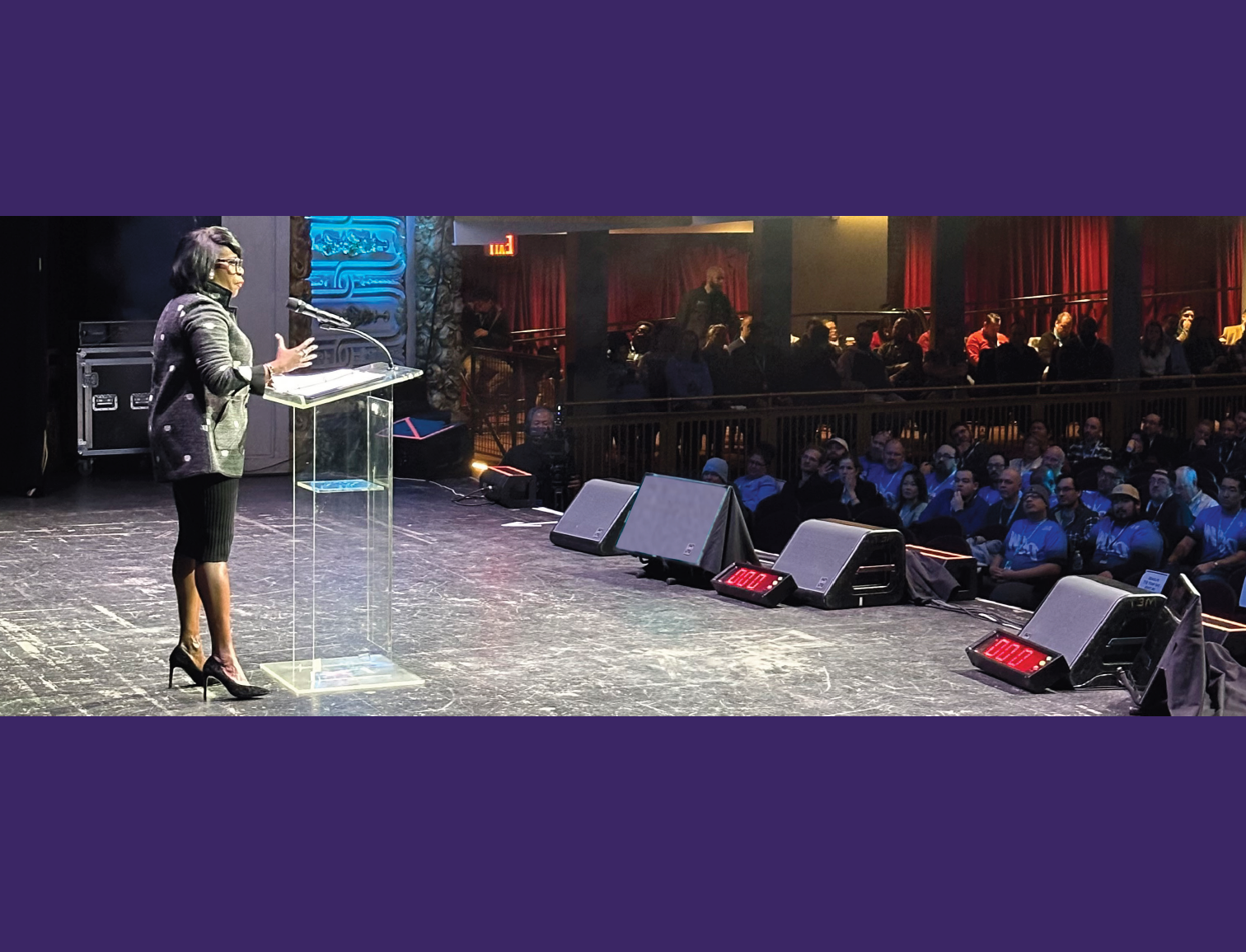 Cherelle Parker speaking on stage to a large audience