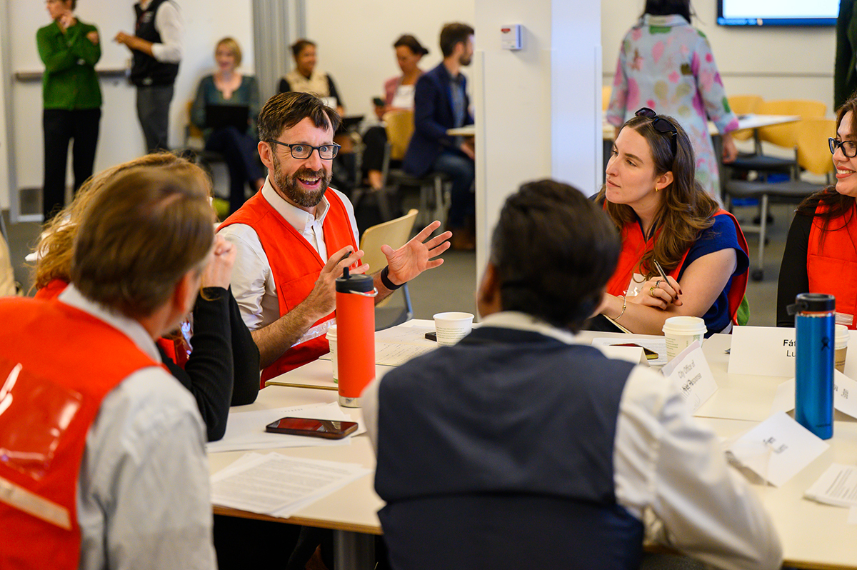 group of people talking around a table