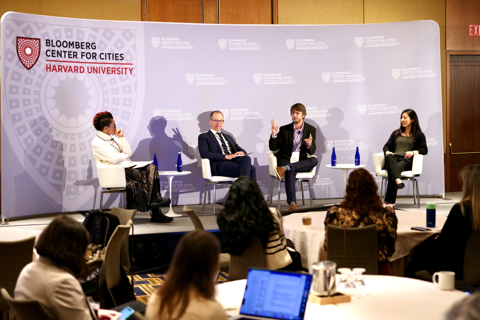 Stage with four urban researchers in conversation