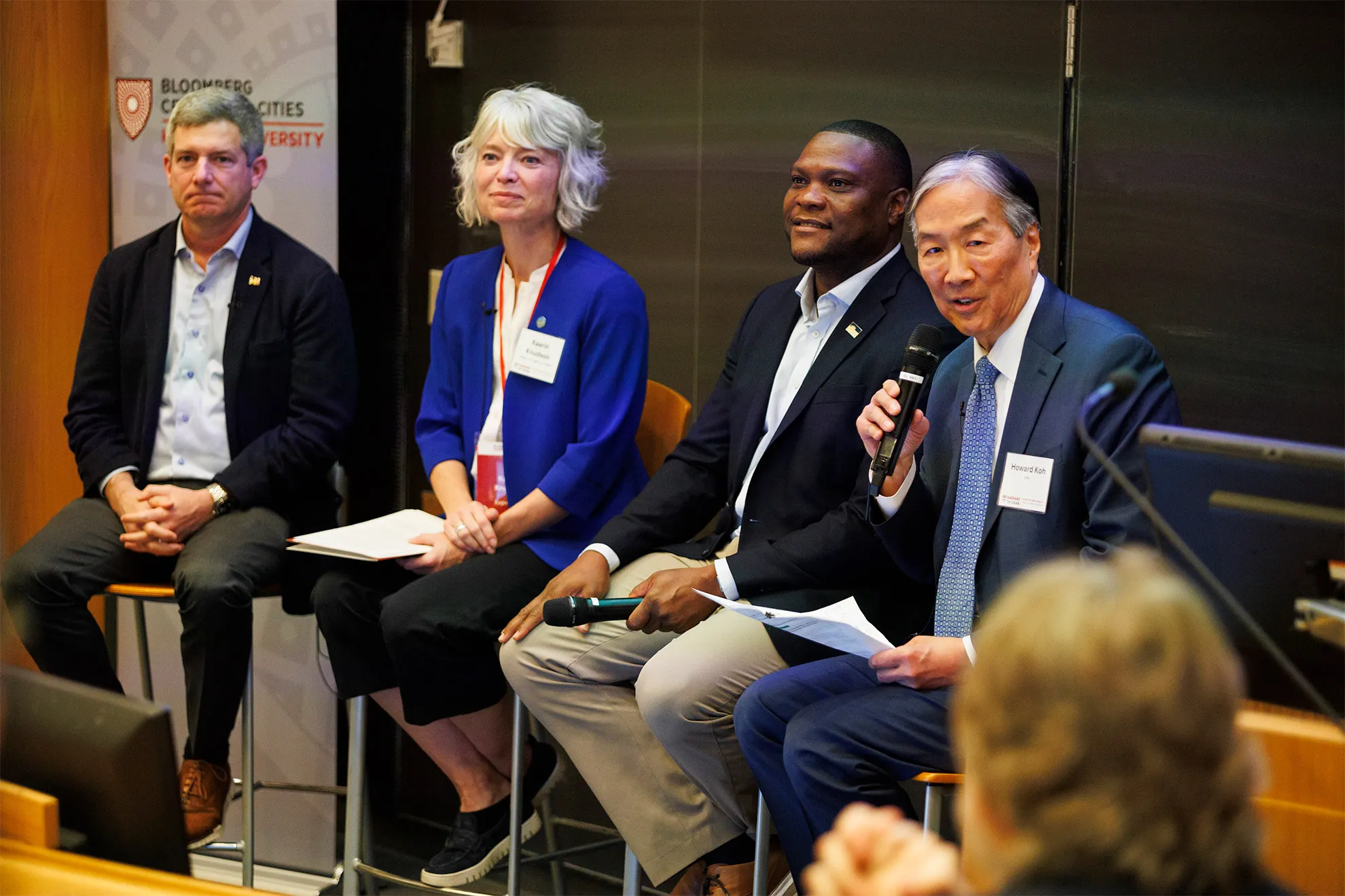 Mayors seated on stage for a panel discussion