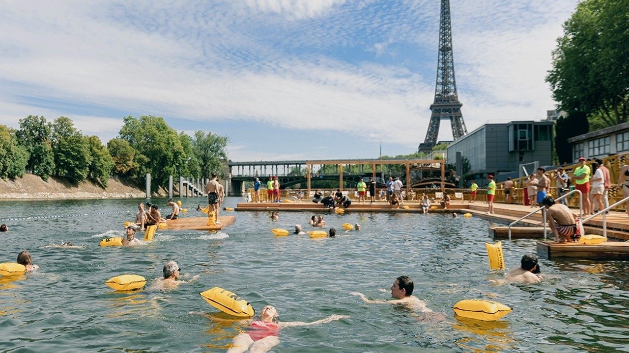 people swimming in Paris river